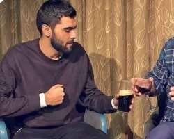Adam McKola consuming alcohol